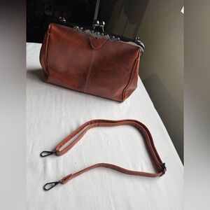 Rich Brown PU leather handbag classic metal frame clasp with ornate detailing.